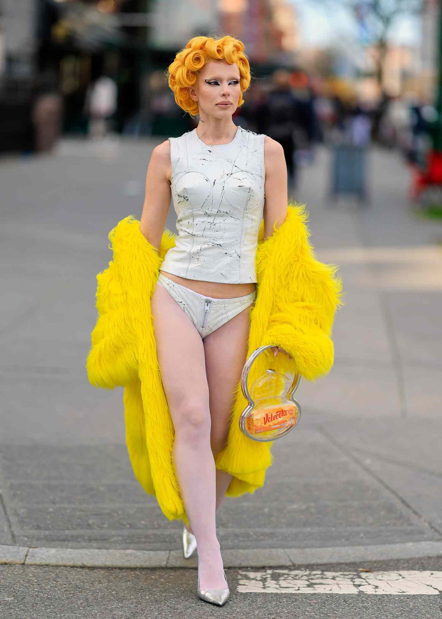 Julia Fox erosion angstrom unit yellow pin-up-curl hairstyle.