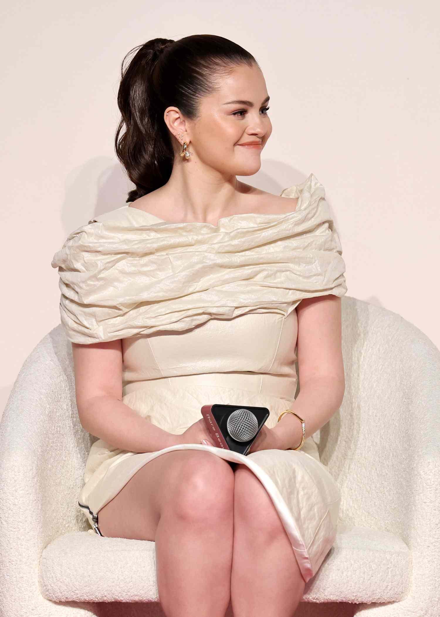 Selena Gomez in an off-the-shoulder white dress.