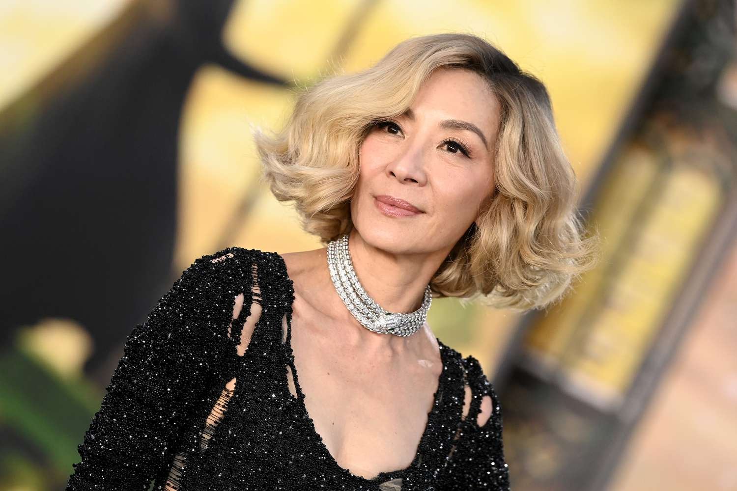 Michelle Yeoh with wavy blond bob