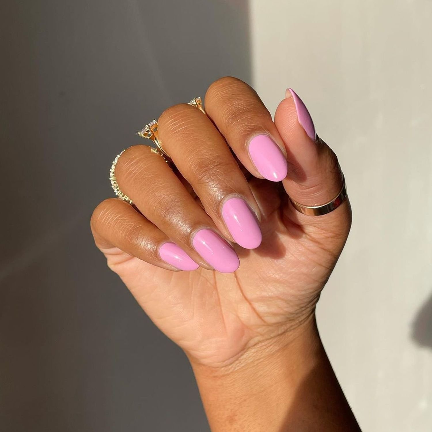 Pale pink nail polish on ovoid nails
