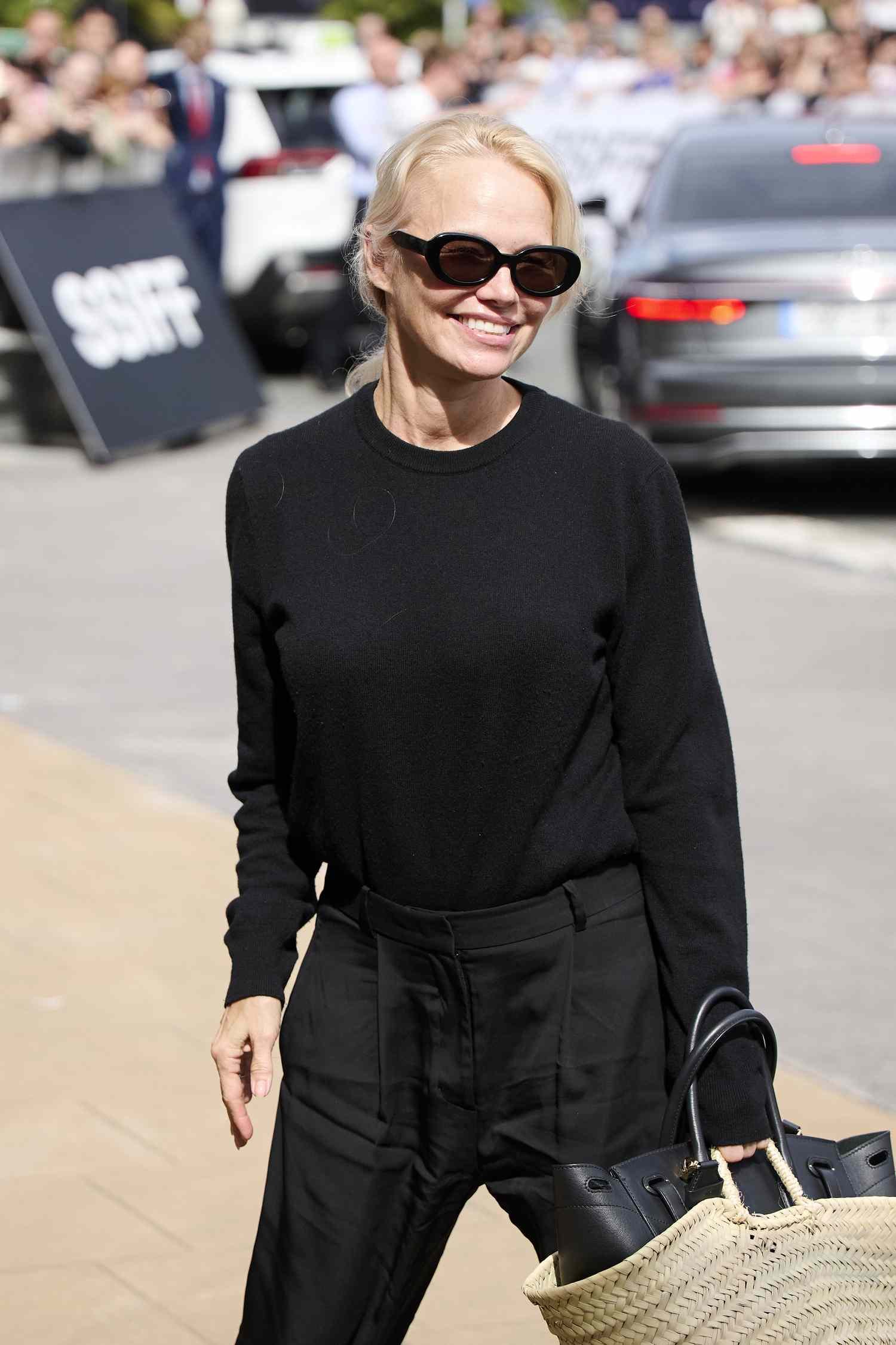Pamela Anderson Smiling Black dark glasses outside Maria Cristina Hotel in Spain at 2024 San Sebastian International Film Festival