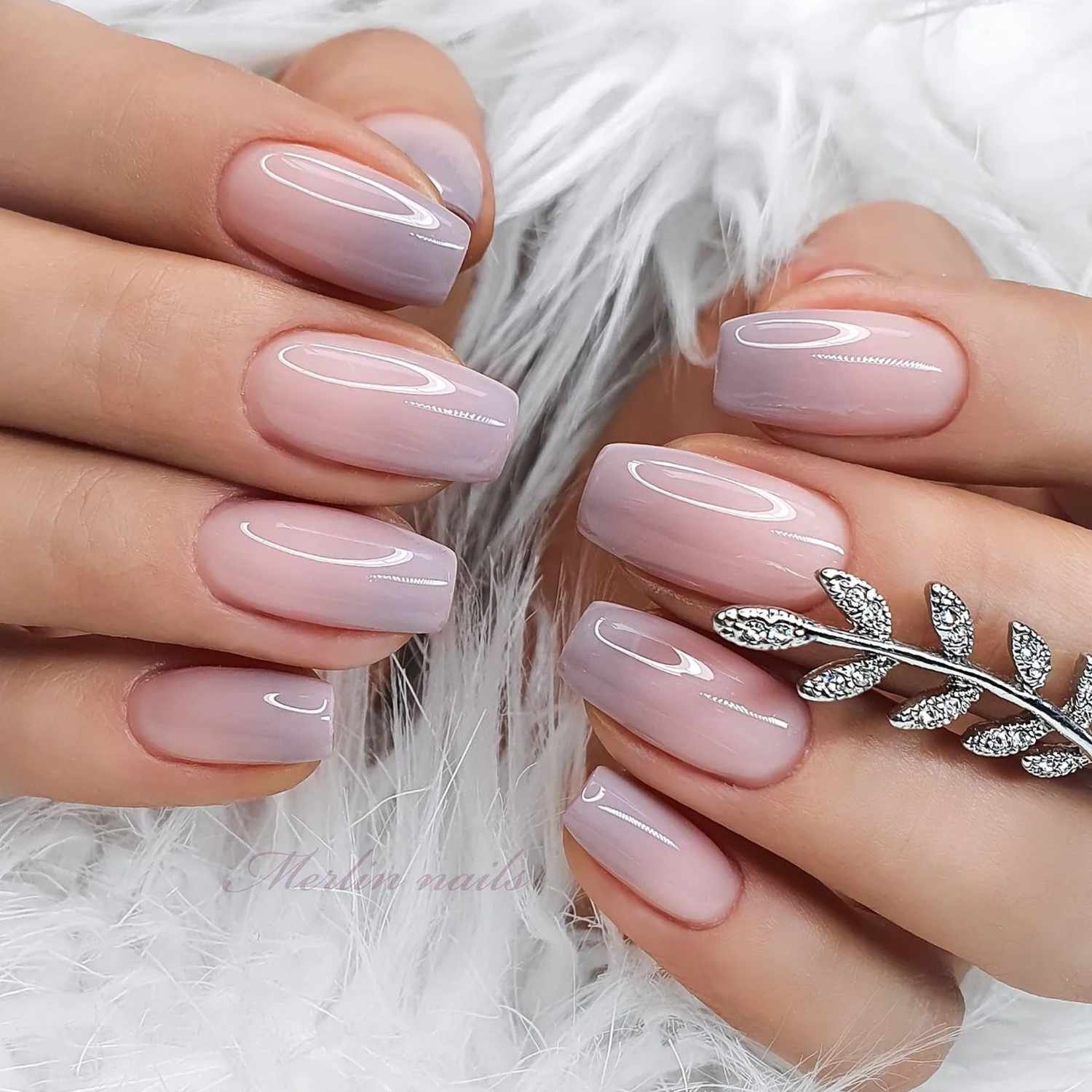 close up of nail with light pink and grey ombre manicure