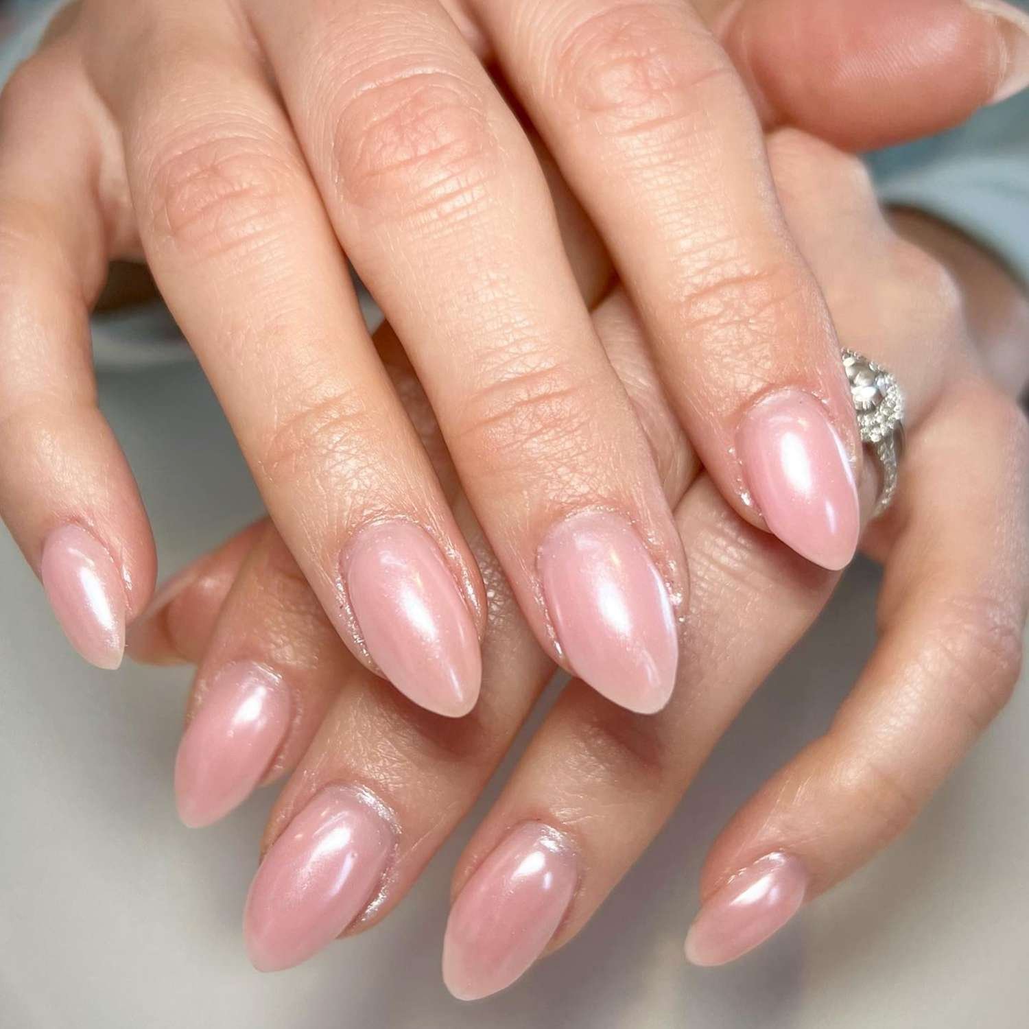 close up of nail with light pink chrome manicure