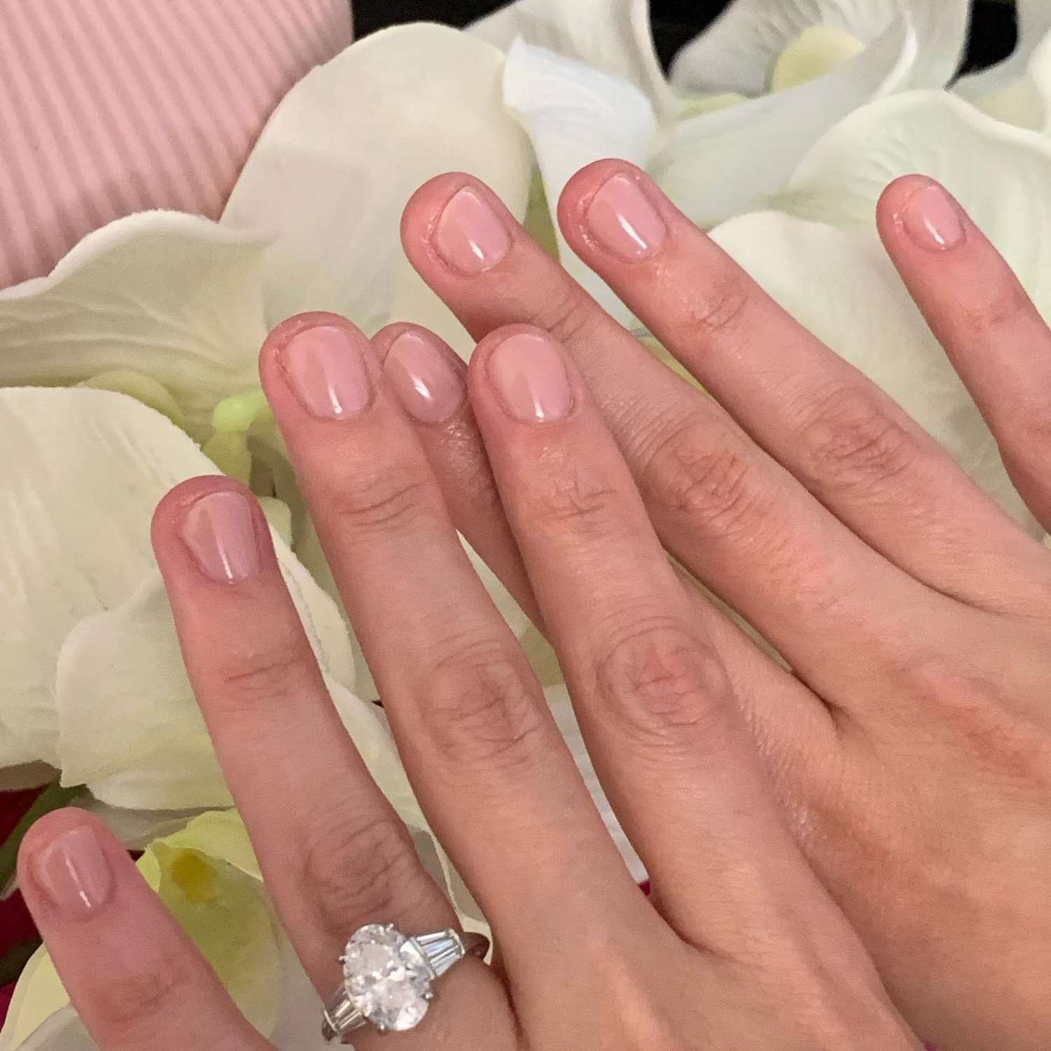 close up of nail with visible radiation pink manicure