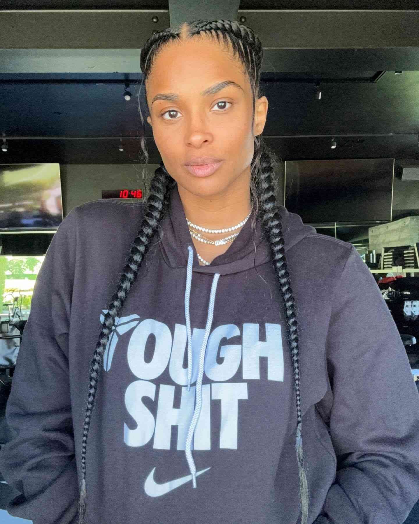 Ciara wearing supernumerary long, French-braided plaits