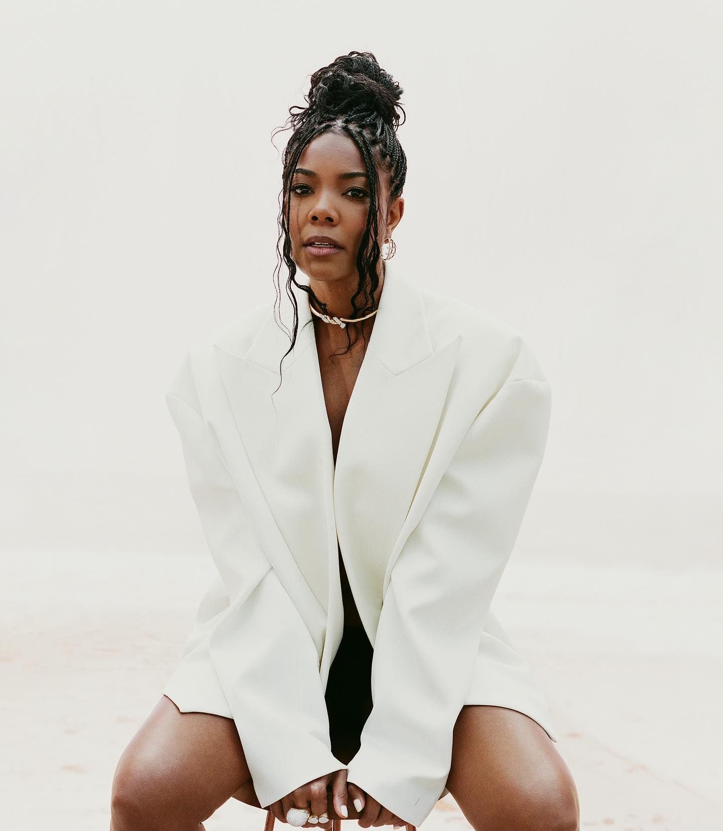 Gabrielle trades union with a high, box-braided bun and face-framing braids