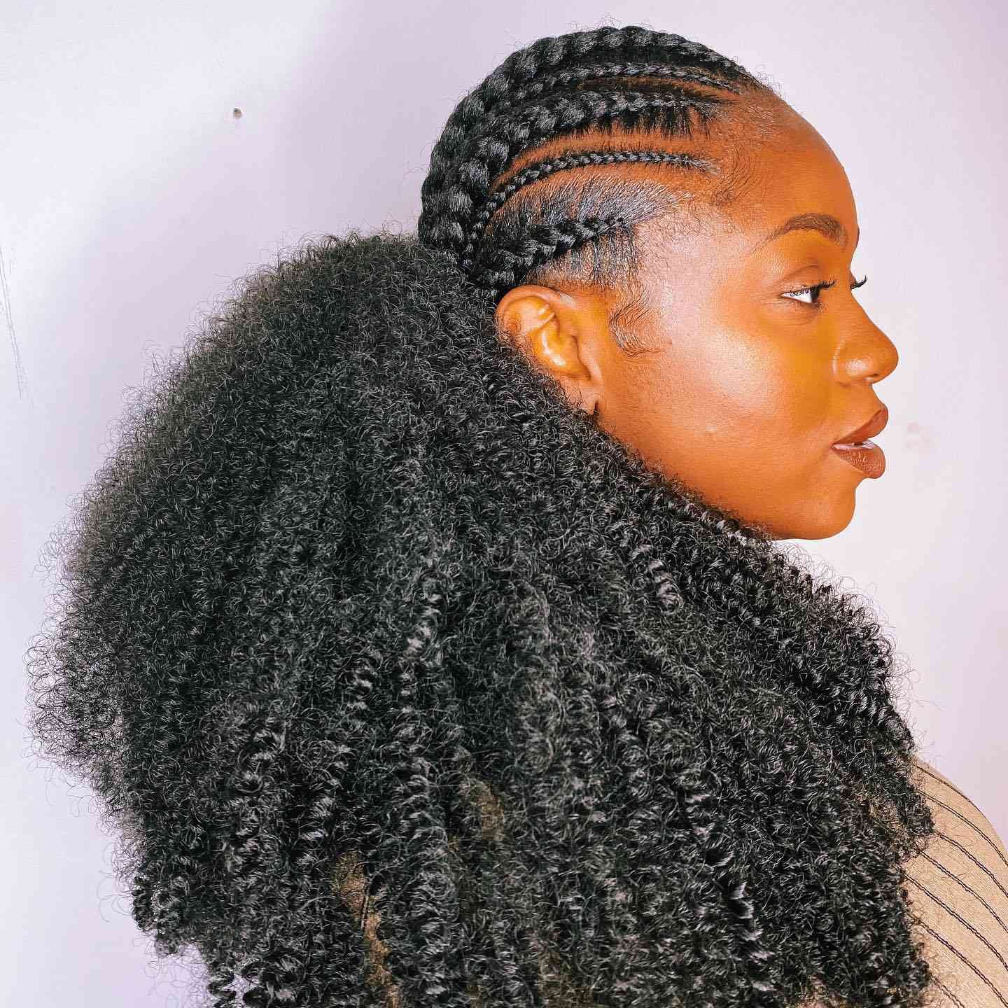 A somebody with crocheting tress and angstrom unit long, coily low ponytail