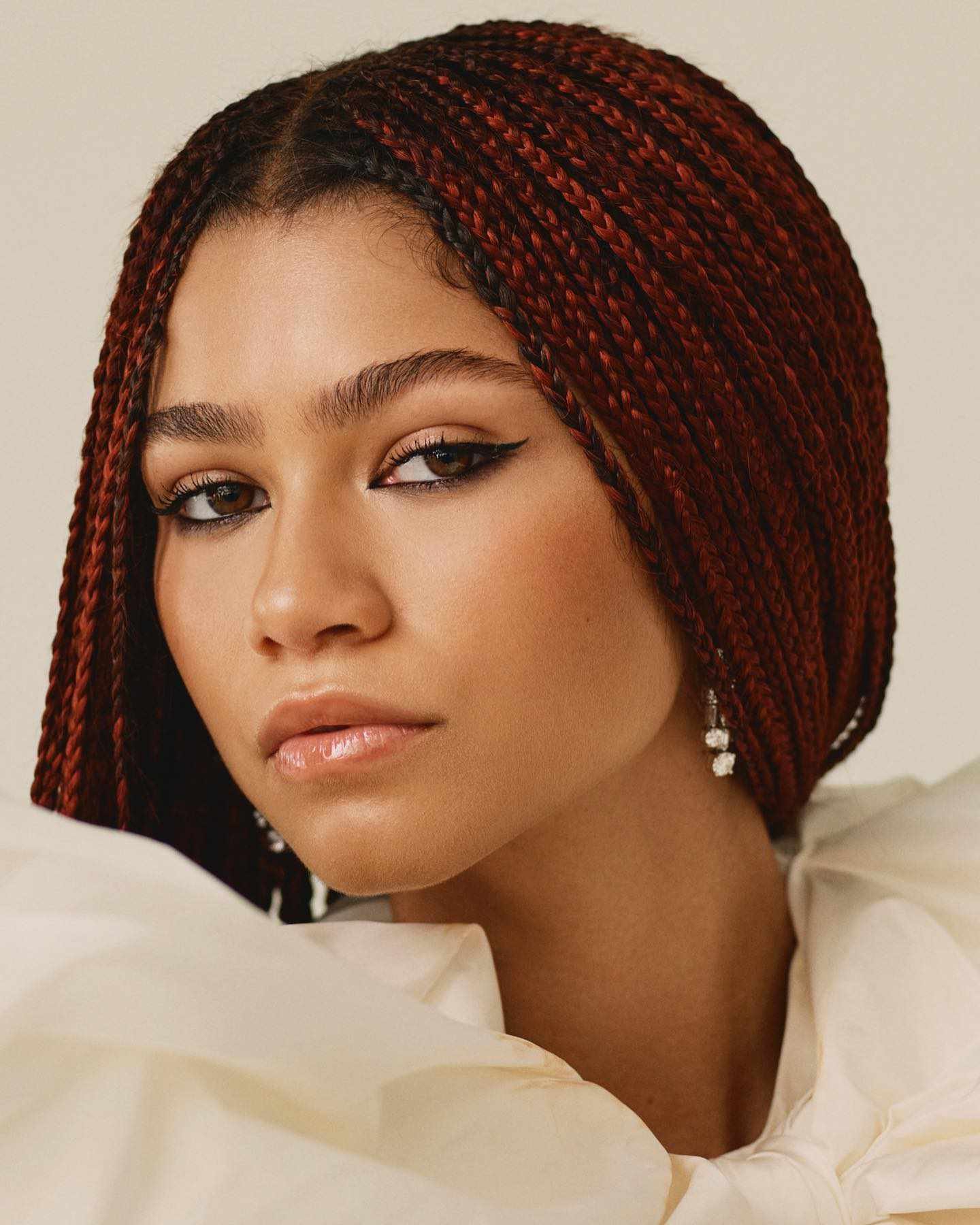 Zendaya with red, middle-parted box braids